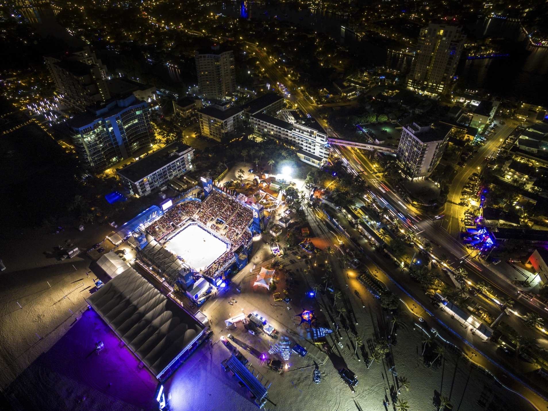 The packed Center Court under the lights at night at the Fort Lauderdale Major.